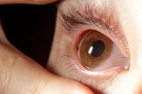 Eye close up held open